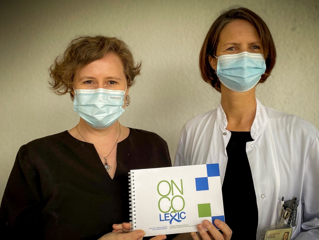 ESCA CS Volunteer Ashley & Board member Conny with a copy of the new Oncolexic