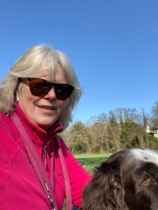 a woman posing with her dog