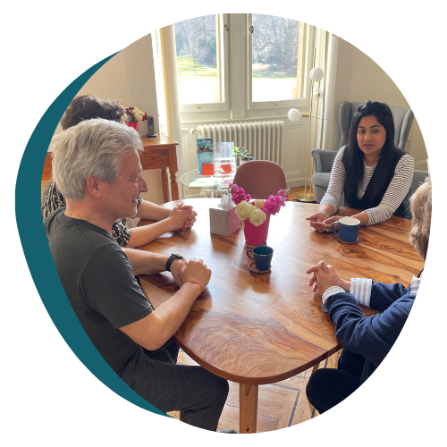 People sitting in the Cancer Support Switzerland Drop-In Centre in Geneva.