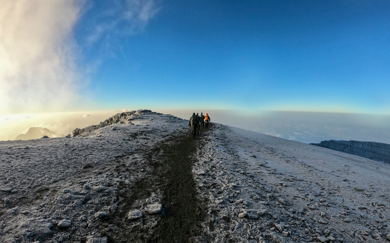 A photo of people hiking Mount Kilimanjaro