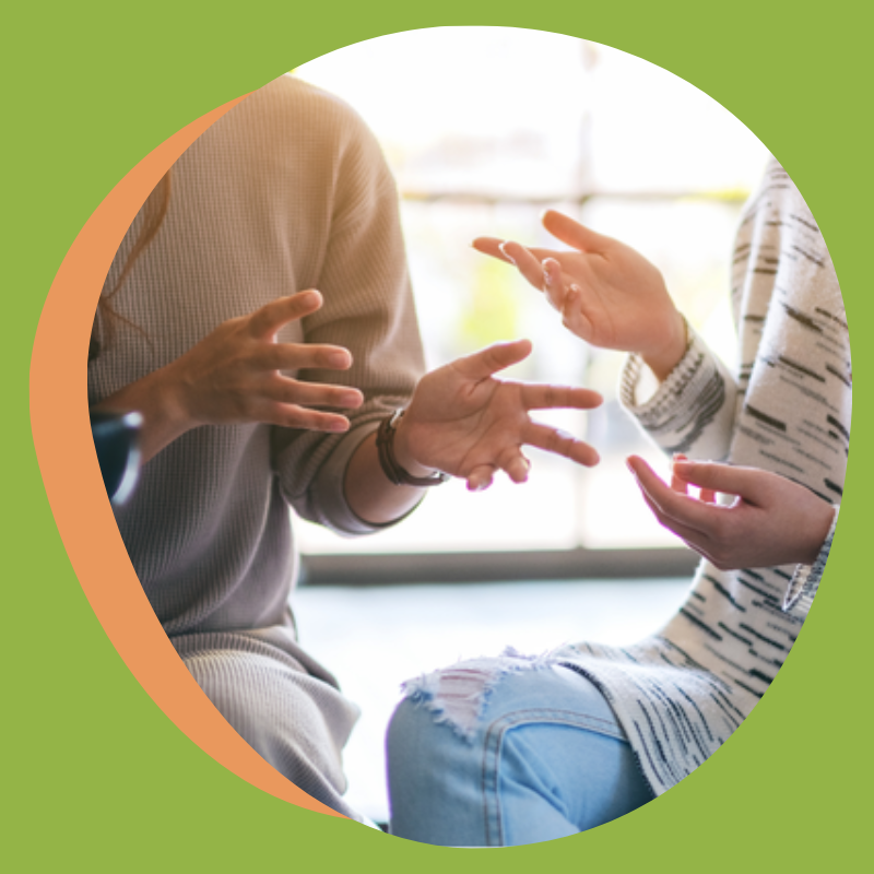 two people talking with focus on their hands.